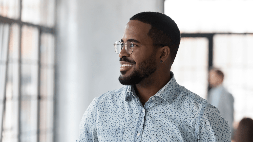 Man in office looks out of the window
